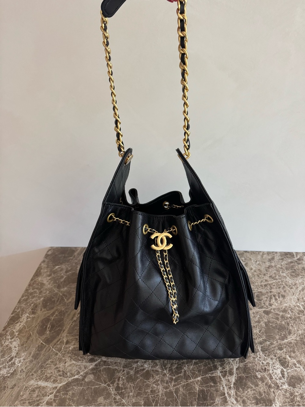 Black Quilted Leather Bucket Bag with Gold Chain Accent